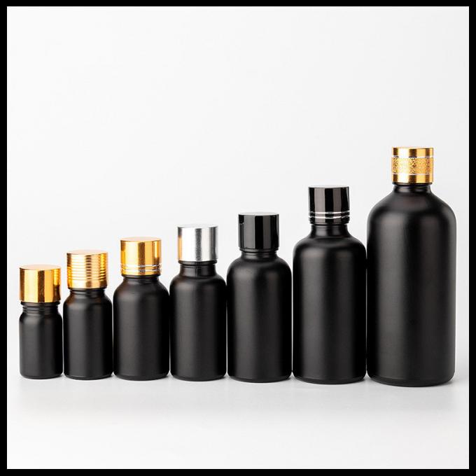 Cosmetico glassato il nero delle bottiglie di vetro dell'olio essenziale di colore che imballa forma rotonda